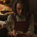 Lyra and her daemon Pantalaimon with the alethiometer, His Dark Materials, BBC One