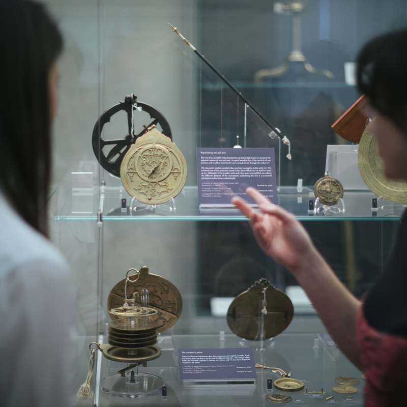 Visitors looking at astrolabes in the Top Gallery